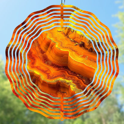 Wind spinner design with orange and yellow wavy pattern, geode pattern
