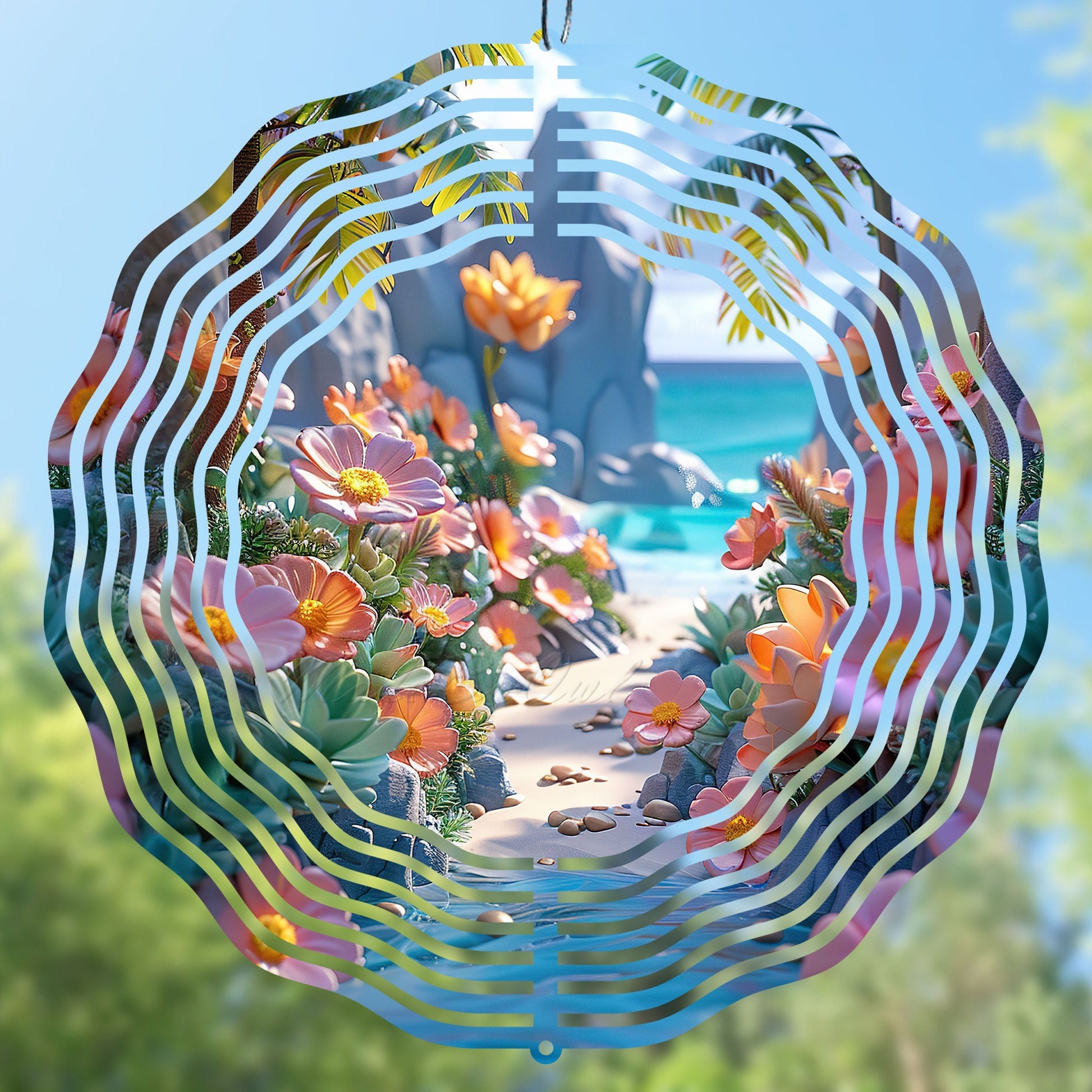 Decorative wind spinner design with floral design against a beach background