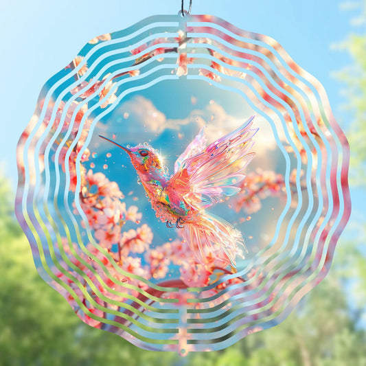 Wind spinner sublimation design with a colorful hummingbird against a blue sky and cherry blossom background.