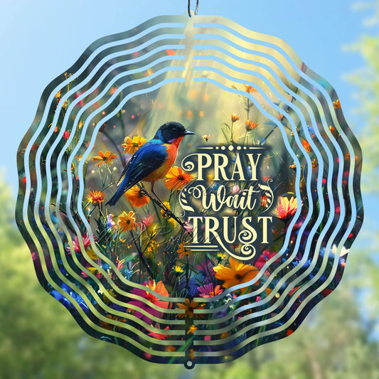 Wind spinner design with a bird and floral theme, featuring the motivational quote 'Pray, Wait, Trust'.